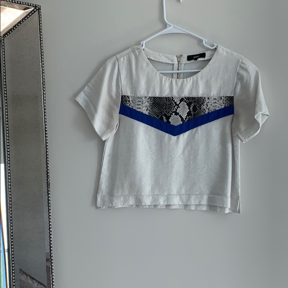 White blouse with a beautiful snake print design!